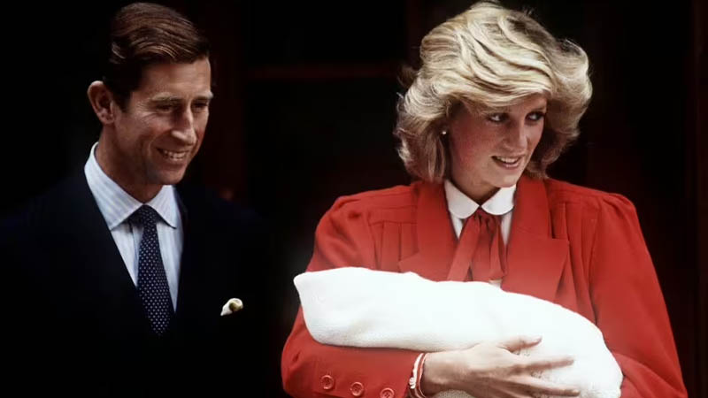Prince Charles and Princess Diana hold Harry after his birth