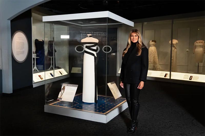 Melania Trump poses next to her inaugural gown